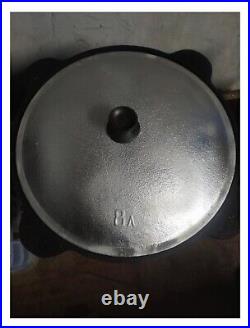 Large black cast iron cauldron for 8 liters