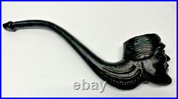 Large cast iron smoking pipe with face