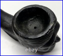 Large cast iron smoking pipe with face